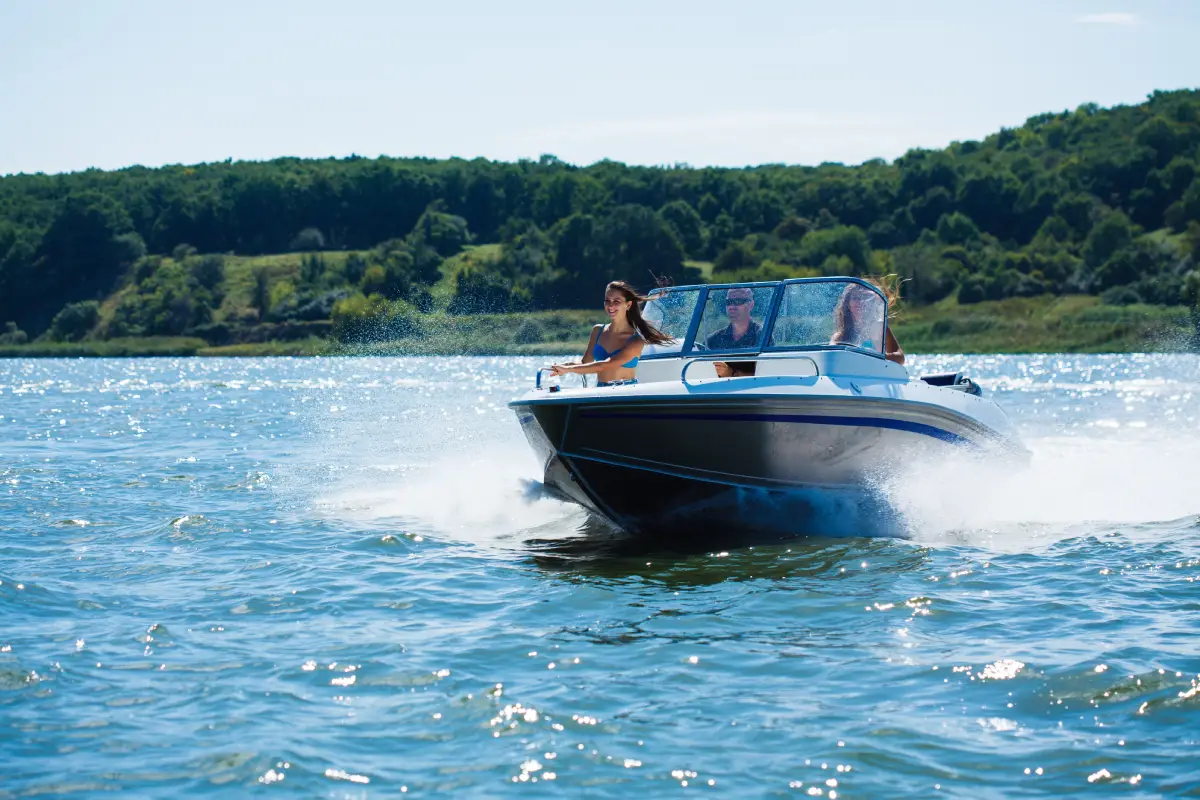 Boat on calm Canadian lake, scenic nature landscape